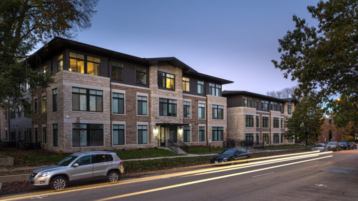 Street view of Church and Prairie apartment building at dusk.