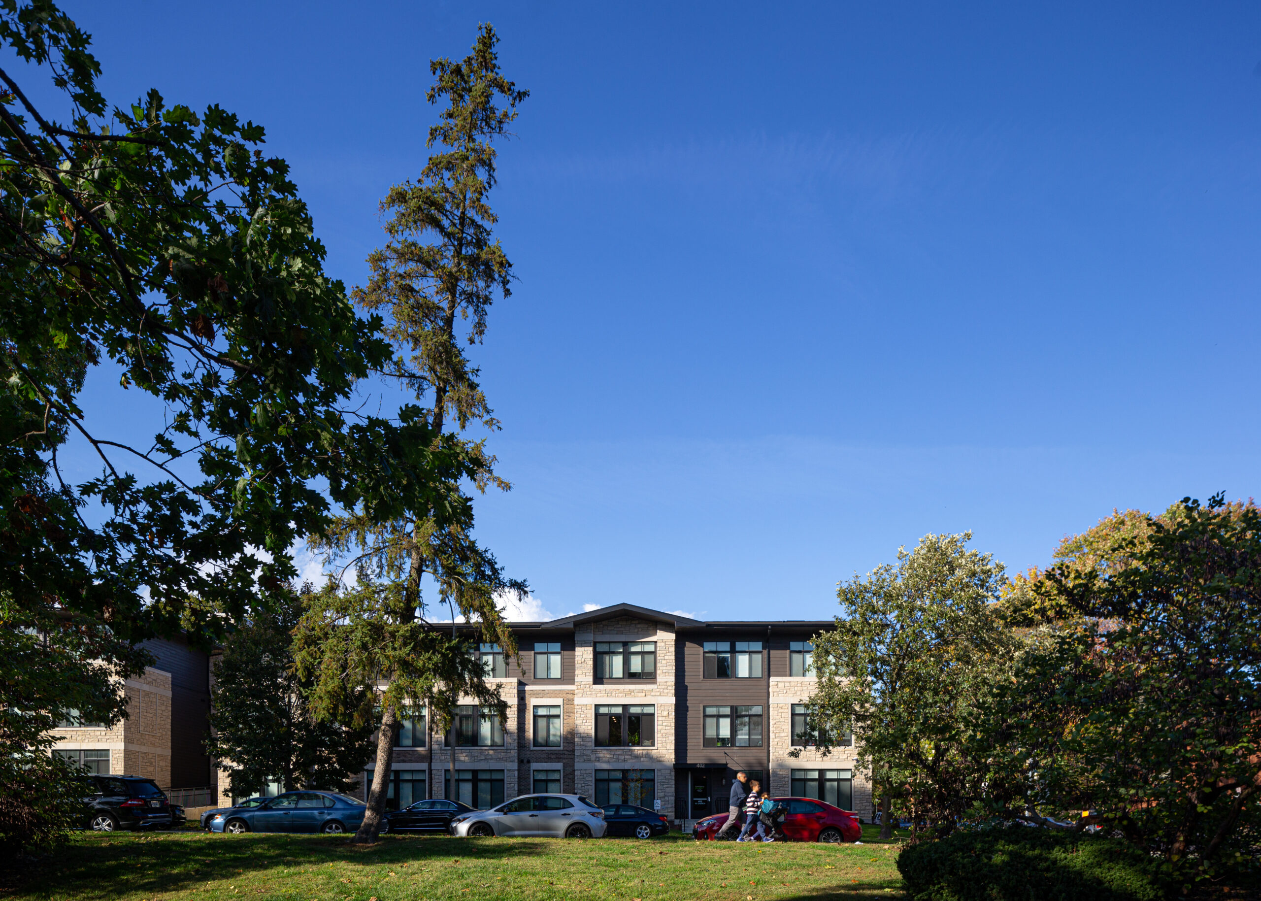 View of Church and Prairie apartment building from West Side Park.