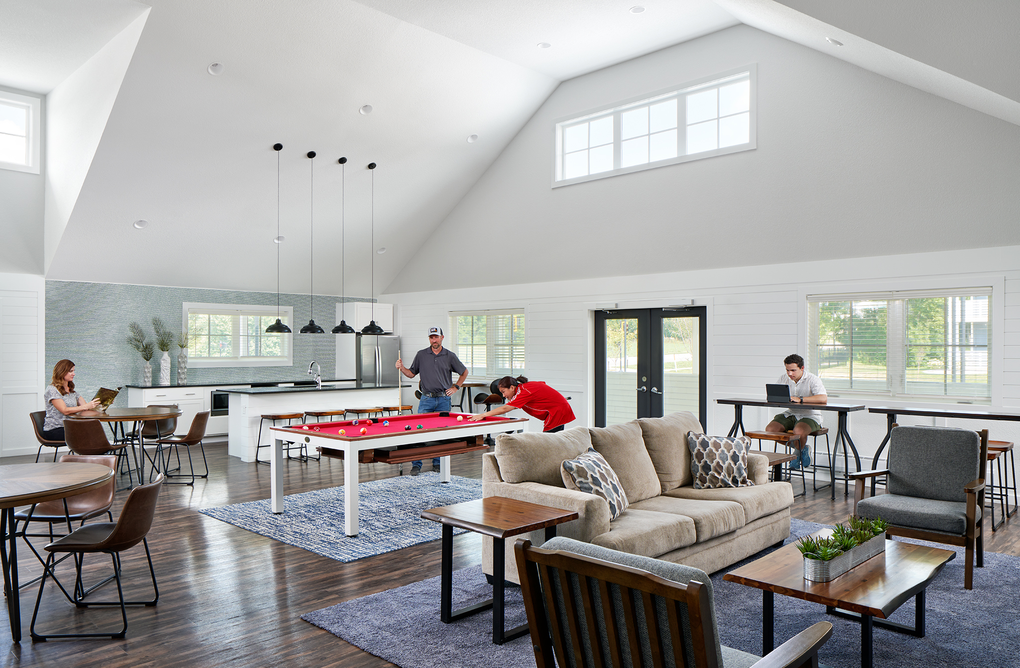 Solace at Mahomet clubhouse interior view with lounge, kitchen and indoor games.