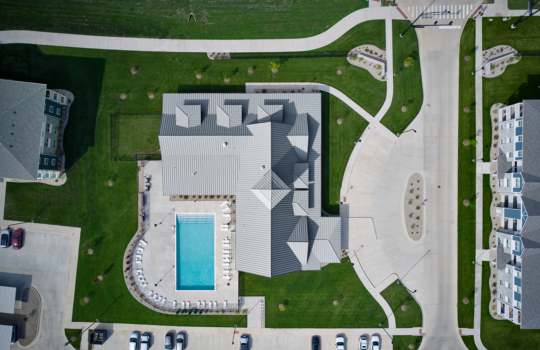 Top view of outdoor pool and clubhouse at the Solace of Mahomet multifamily development.