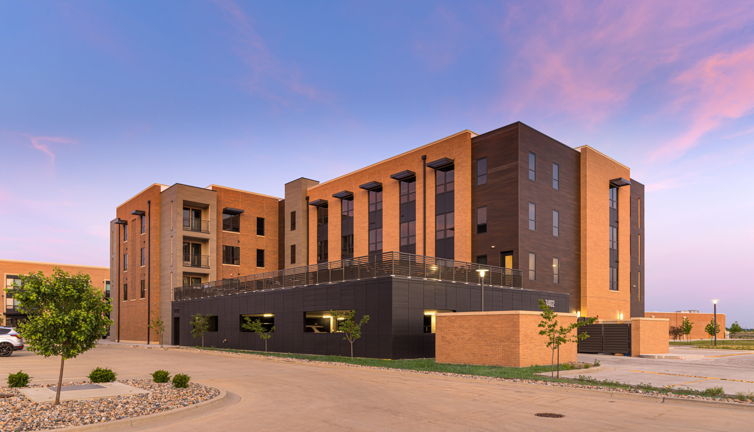 Fields South development phase 2 corner perspective at dusk.