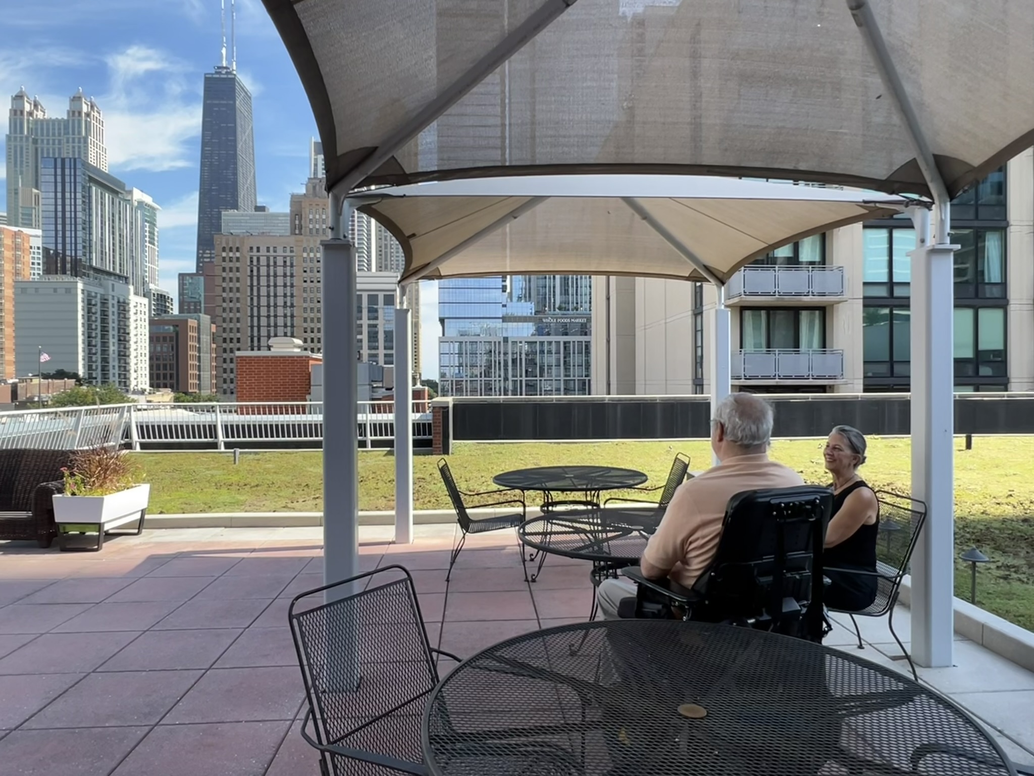 Jack Catlin and Liz Zaverdas at the green roof and deck area of Access Living headquarters building.