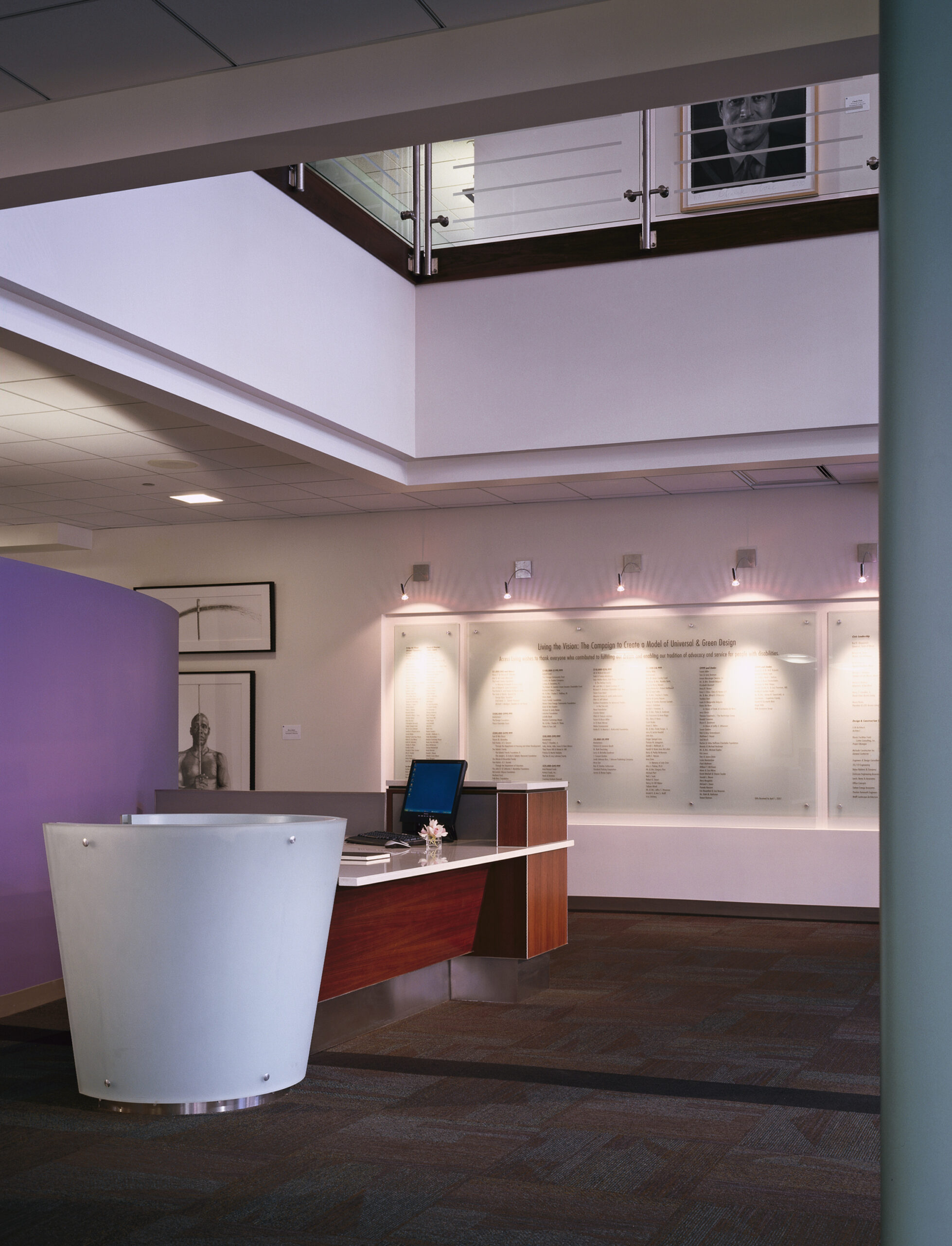 Front desk and donor wall in the reception area of Access Living headquarters building.