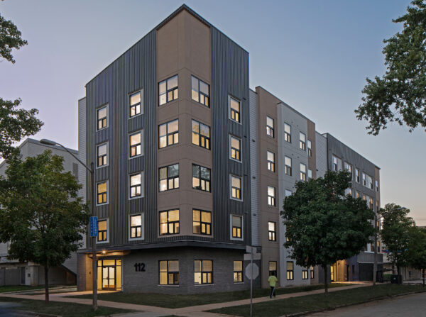 112 E John Street apartments perspective view from south-east side at twilight.