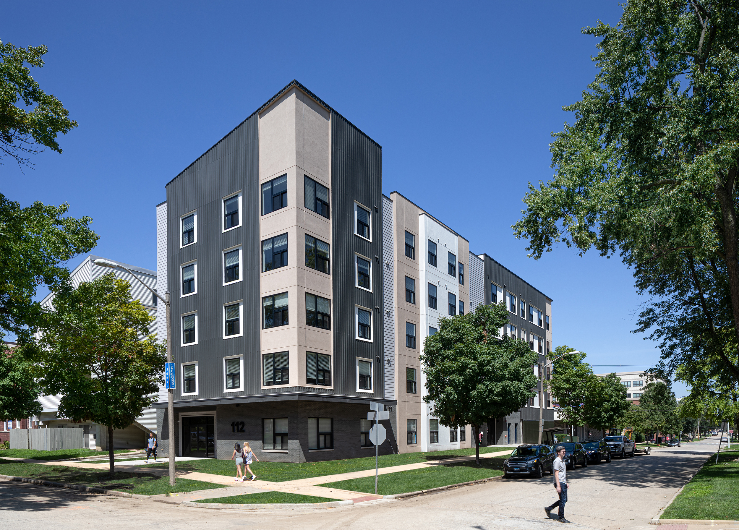 112 E John Street apartment building perspective view from south-east side during the day.