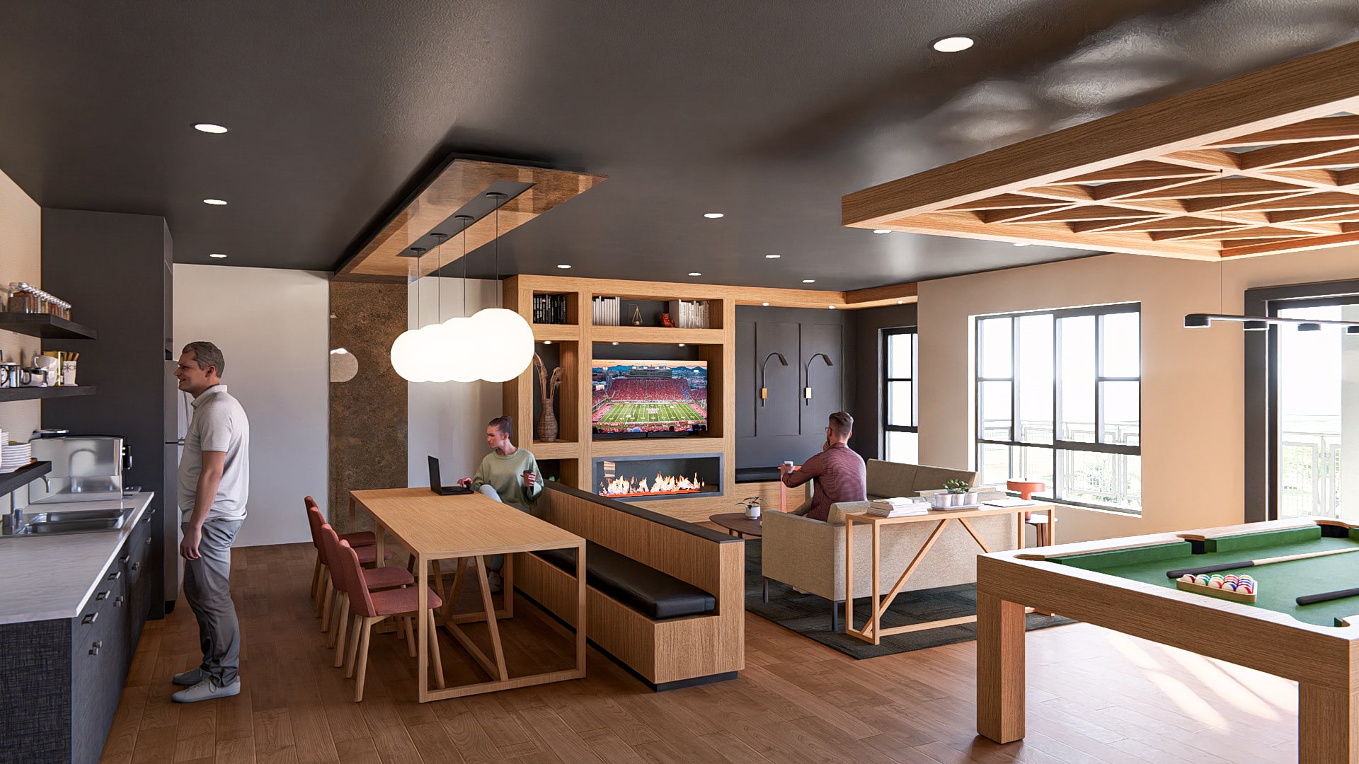 Club Room with lounge seating, kitchen and bar in the Revolve at Ballpark multifamily development.