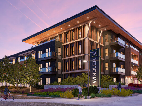 Corner perspective of development at twilight.