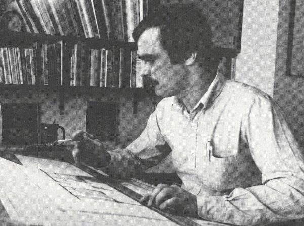 Jack Catlin on his drawing board, black and white younger photo