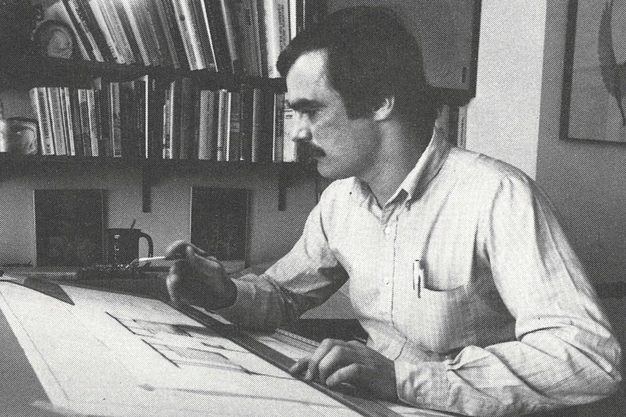 Jack Catlin on his drawing board, black and white younger photo