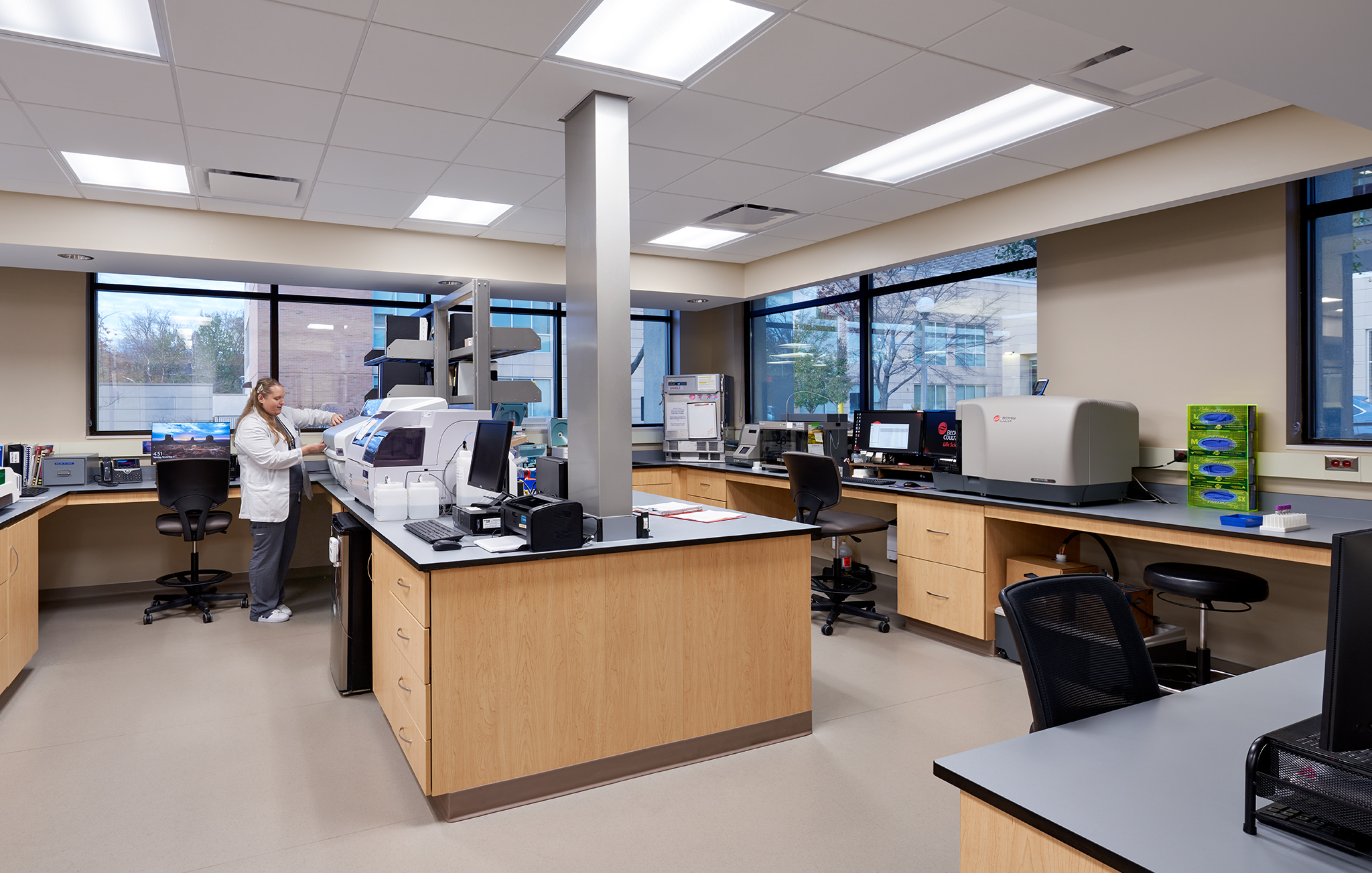 A staff working on equipment at Carle laboratory.