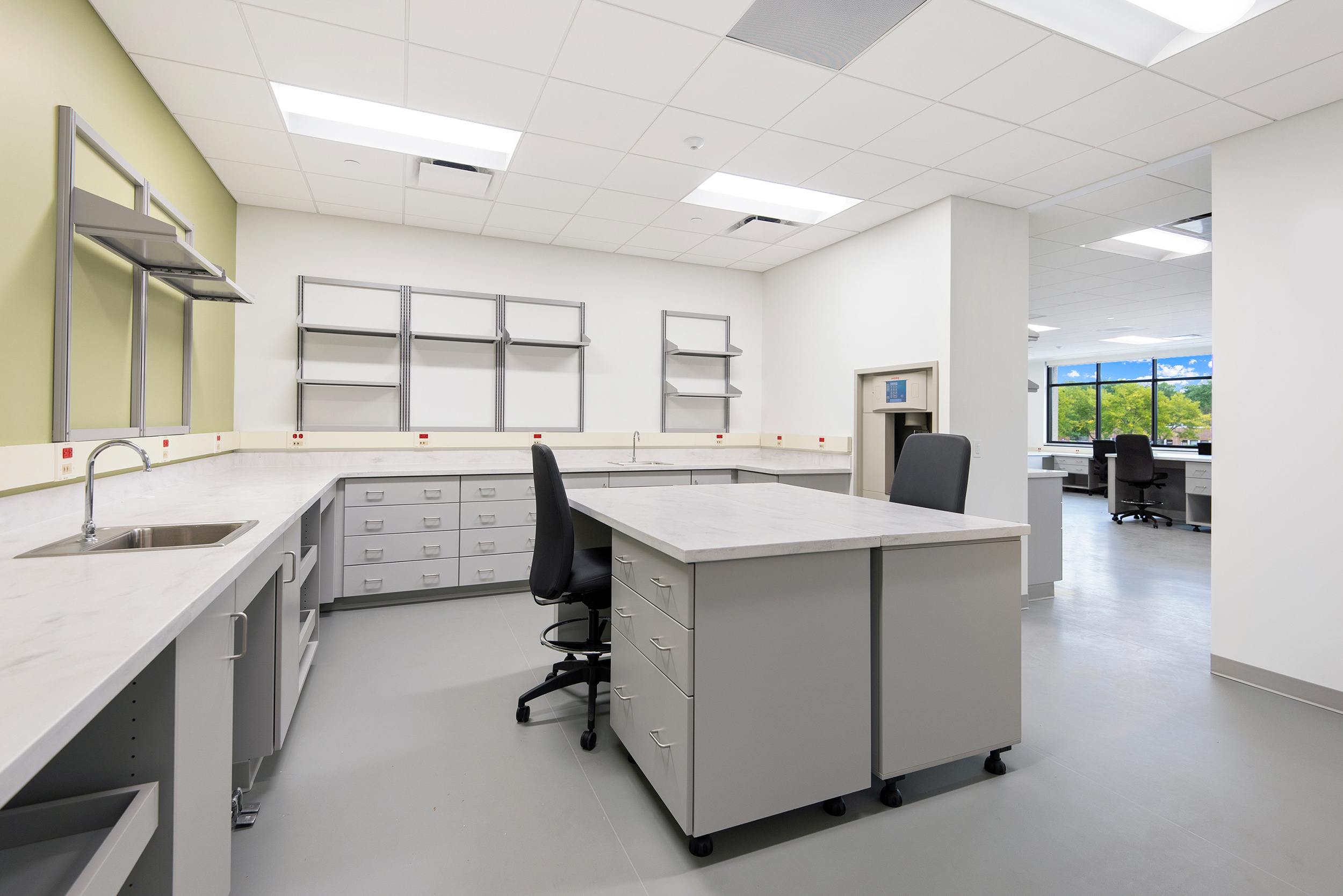 Clinical laboratory rendering with office desk island at McHenry Hospital.