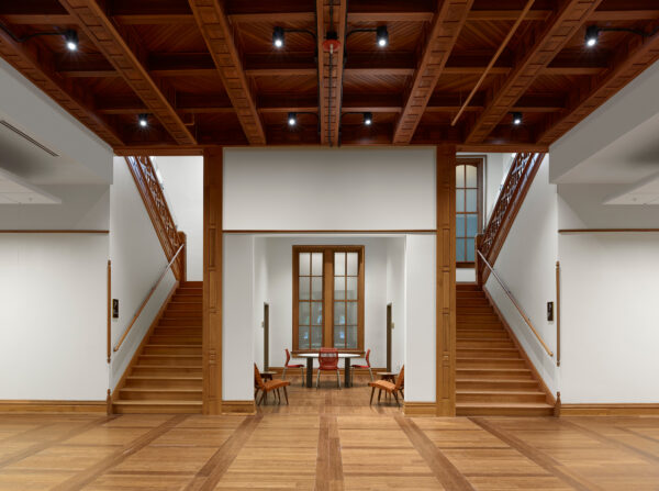 Ornately carved symmetrical grand staircases.