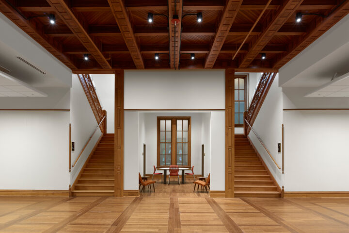 Ornately carved symmetrical grand staircases.